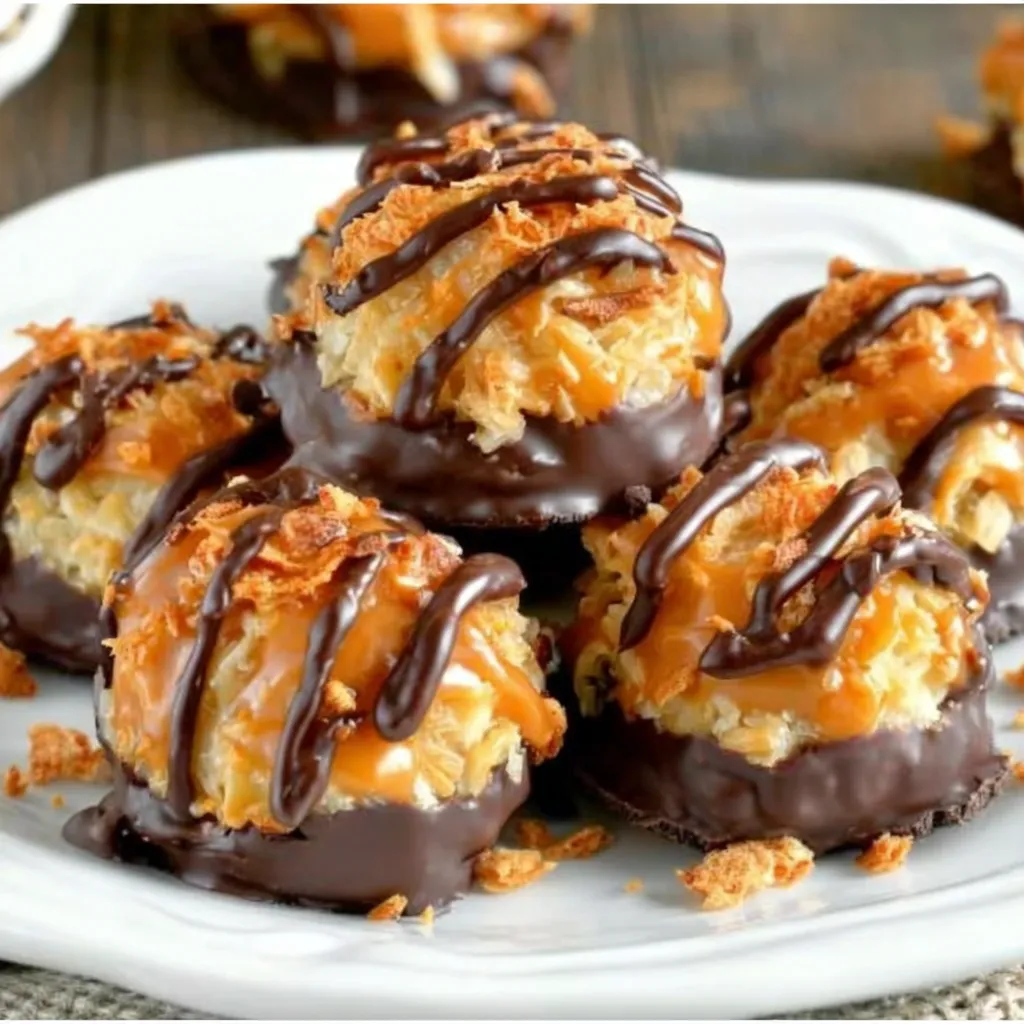 A plate of chocolate covered cookies.