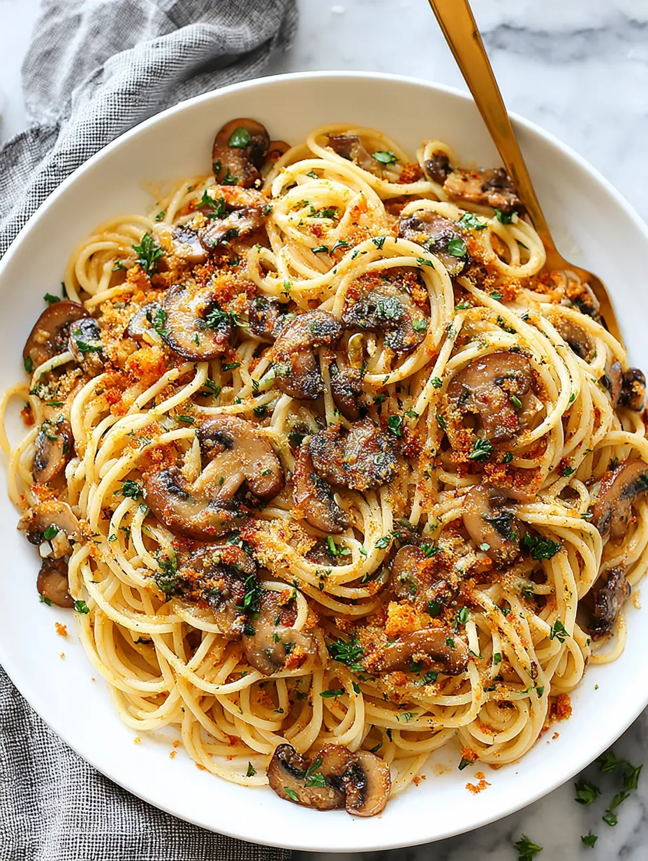 A bowl of pasta with mushrooms and cheese.