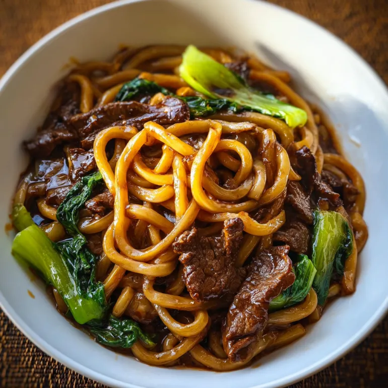 A bowl of beef black pepper udon noodles.