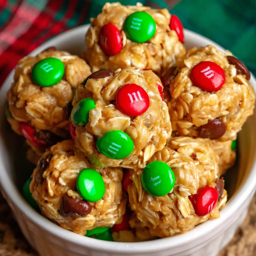 A bowl of Christmas energy bites with green, red and white M&Ms.