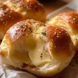 A close up of a cheese bun.