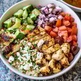A bright bowl with grilled meat and veggies mixed together.