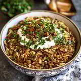There's a bowl topped with crispy onions on the table.
