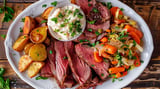 Hearty plate piled with corned beef and cabbage.
