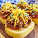 A plate of sloppy joes on a wooden table.
