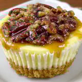 A slice of pecan pie cheesecake.
